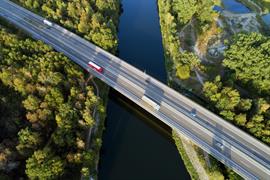 large truck on a freeway over a river