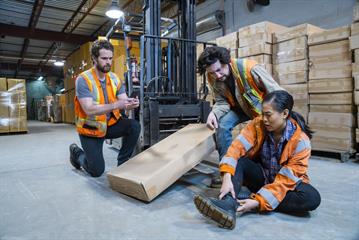 an injured employee holding her ankle