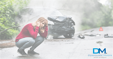 a woman talking on the phone after a car accident