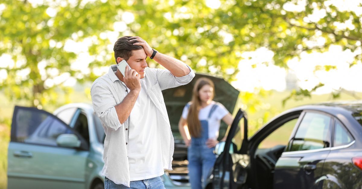 man and woman in aftermath of car accident