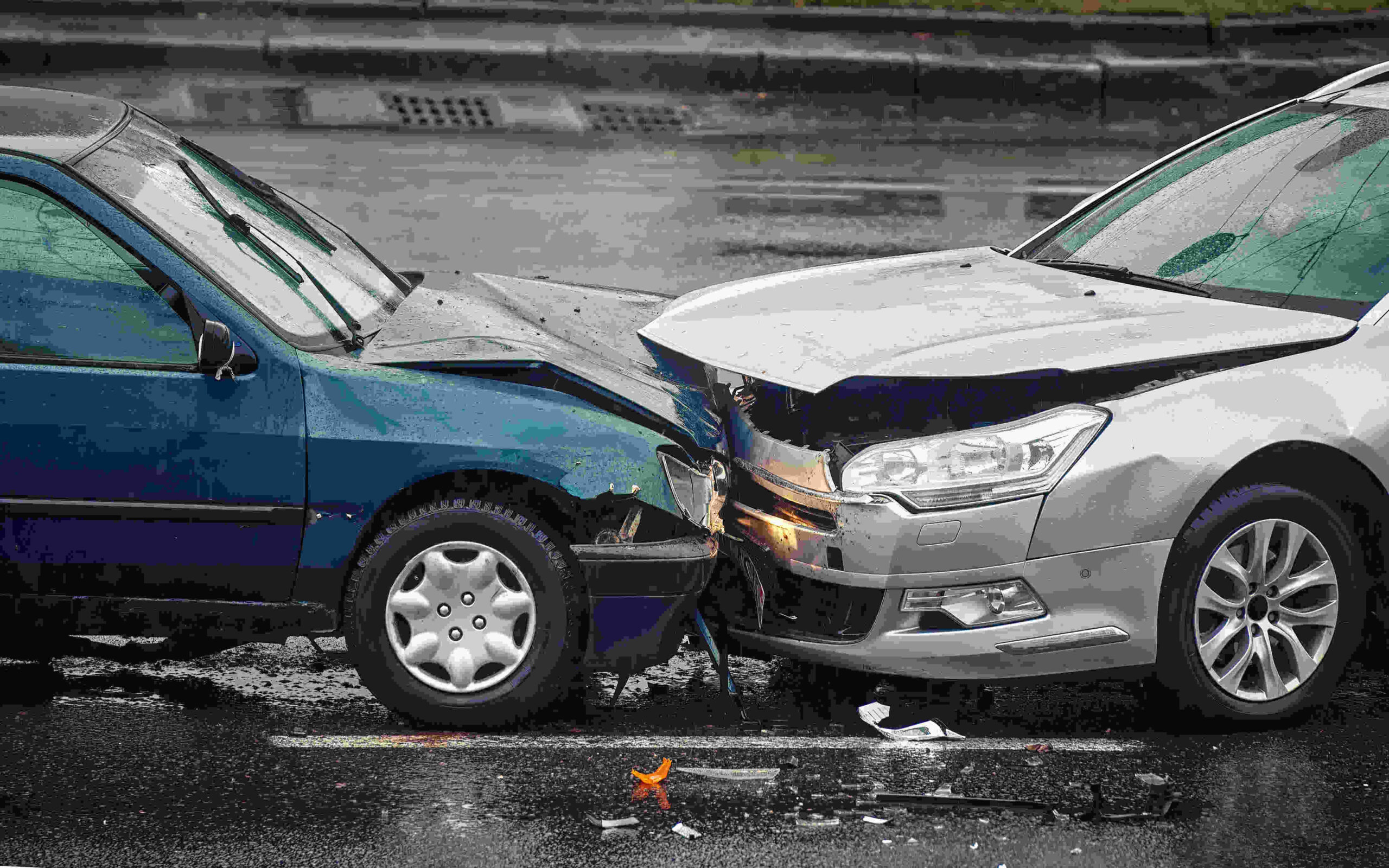 Image of head on collision between two cars.