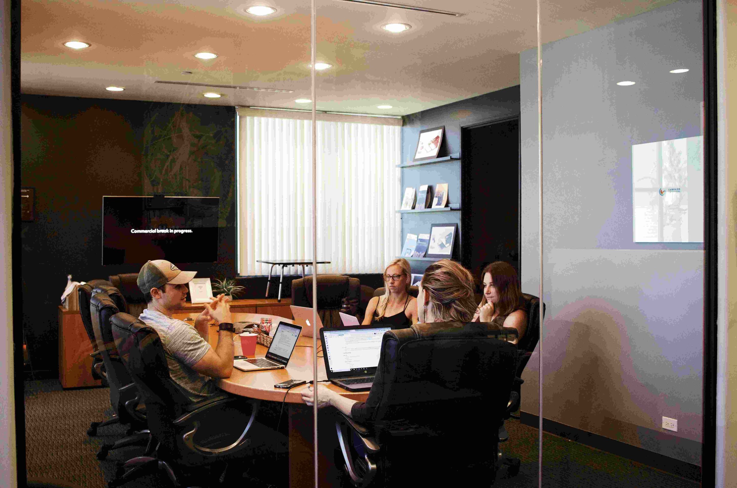 Lawyers sitting in a conference room.