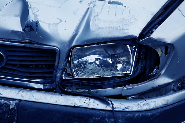 Closeup of car with damaged front headlight