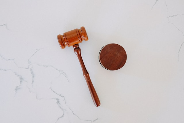 A gavel against a marble background.