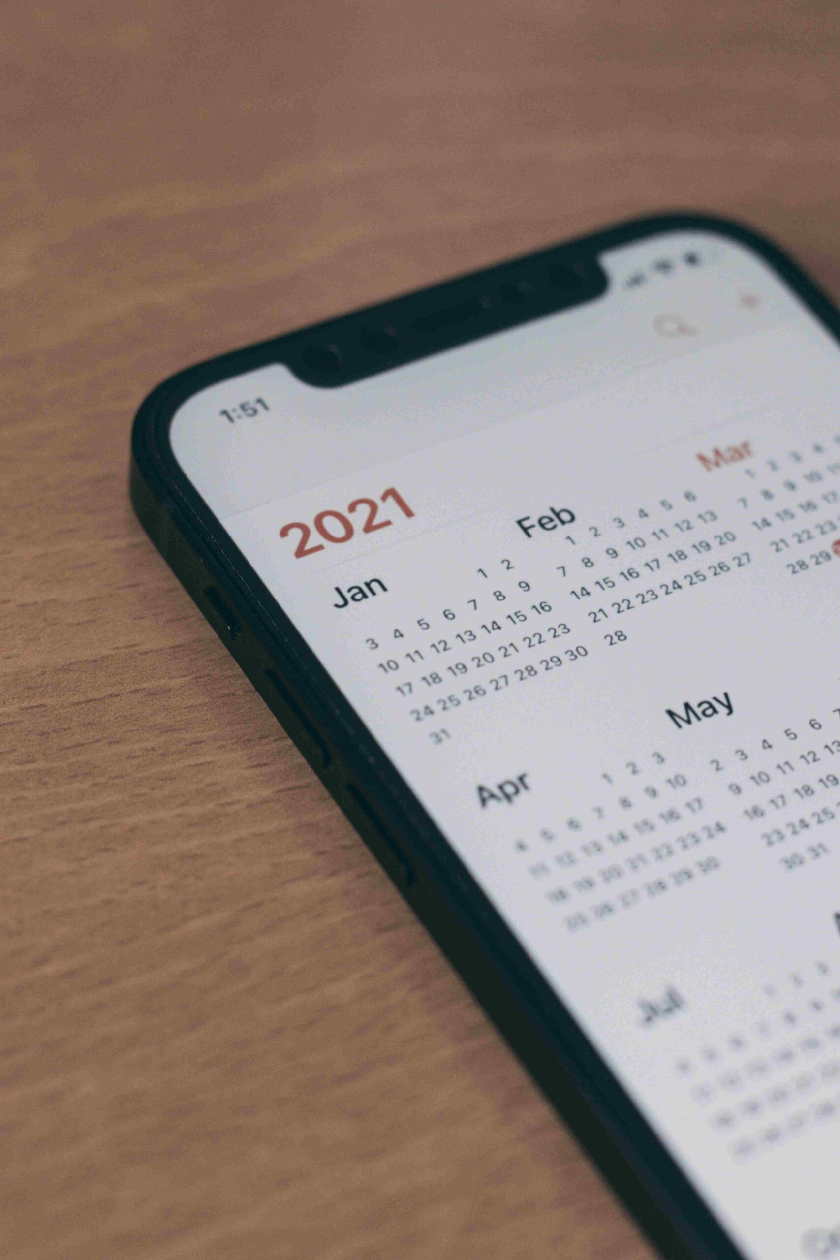 Phone with a calendar of the year showing on the screen.