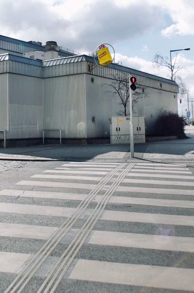 Image of a crosswalk with a red light.